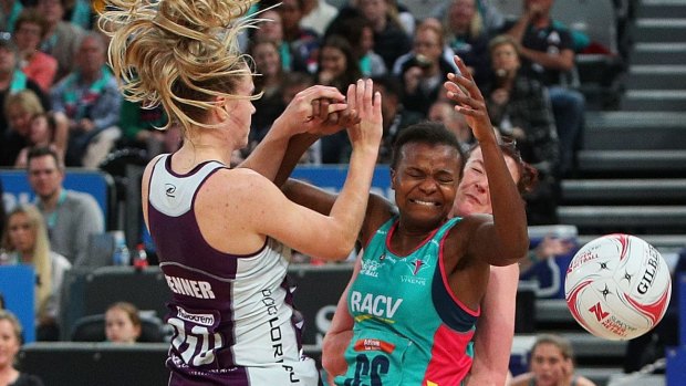Mwai Kumwenda of the Vixens clashes with the Firebirds defence 