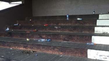 Cans and bottles strewn about the grandstand at Monash Park at Gladesville on Sunday. 