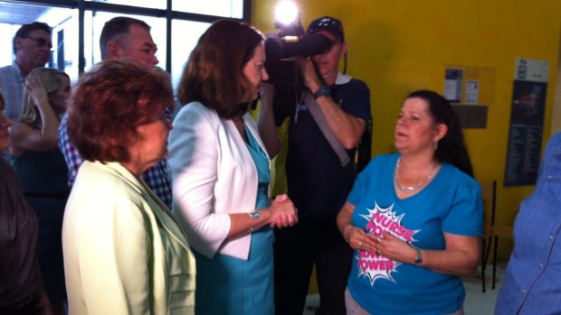 Opposition Leader Annastacia Palaszczuk speaks with a nurse in Townsville.
