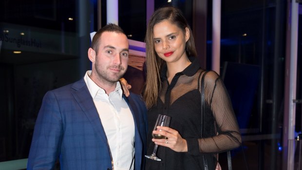 Luke Hunt and Samantha Harris at Sunglass Hut's annual summer party at The Calyx in the Royal Botanic Garden on Wednesday.