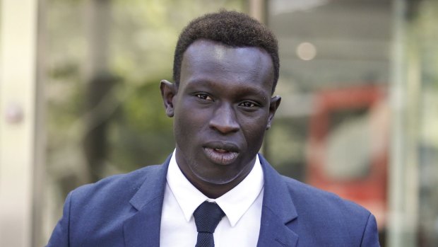 North Melbourne player Majak Daw outside the County Court on Thursday after being found not guilty of rape charges. 