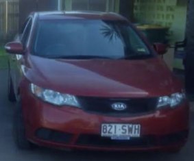 The red sedan the three prisoners are believed to be travelling in.