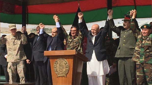 Afghan President Ashraf Ghani, to the right of the podium, is joined by top US and Afghan military leaders for the launch of the Afghan Army's new special operations corp on Sunday.