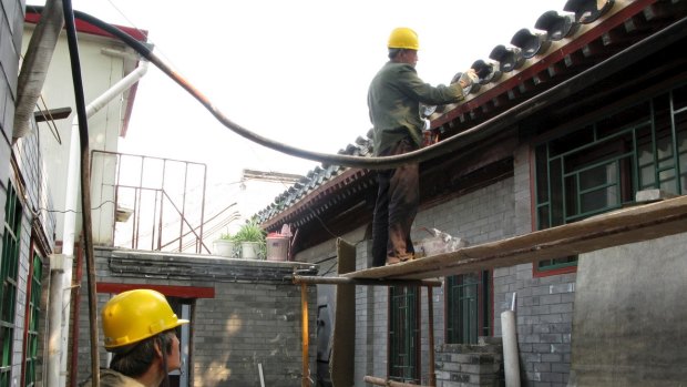 Beijing authorities are trying to curb real estate prices by limiting the number of properties residents can own.
