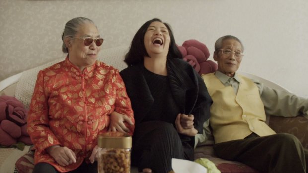 Guo Pei and her parents in a scene from <I>Yellow is Forbidden</I>.