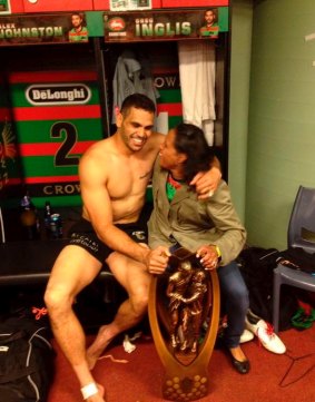 Magic moment: Inglis and Cathy Freeman embrace with the premiership trophy.