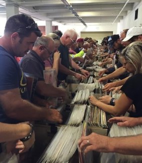 Music lovers search for their favourite music at the 6PR bushfire album sale.