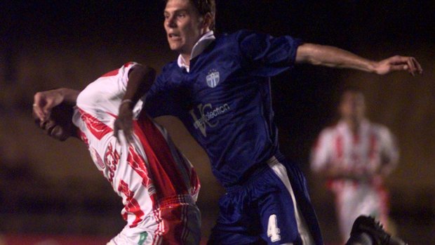 Agustin Delgado, left, of Mexico's Rayos Necaxa fights for the ball against Nick Orlick of Australia's South Melbourne during the 2000 WCC.