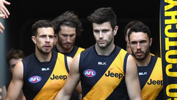 Trent Cotchin leads the Tigers onto the field.