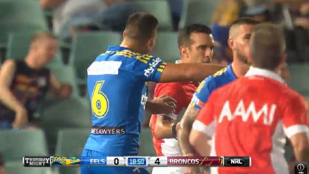 Touchy subject: Corey Norman makes contact with referee Matt Checcin in Parramatta's round one loss to the Broncos.