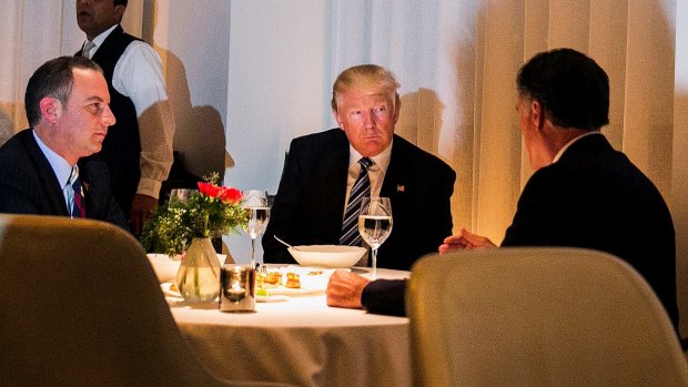 President-elect Donald Trump, Reince Preibus, left, his incoming chief of staff, and Mitt Romney dine at New York restaurant Jean-Georges.
