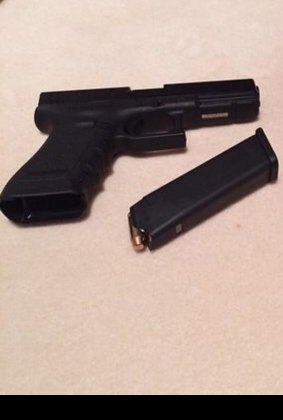 Josh Taylor uploaded this photograph of a handgun to his Facebook page.