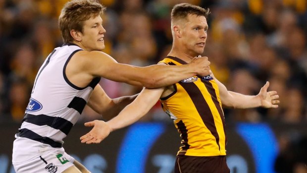 The Cats' Rhys Stanley keeps a close check on Hawthorn veteran Sam Mitchell in Friday night's qualifying final.