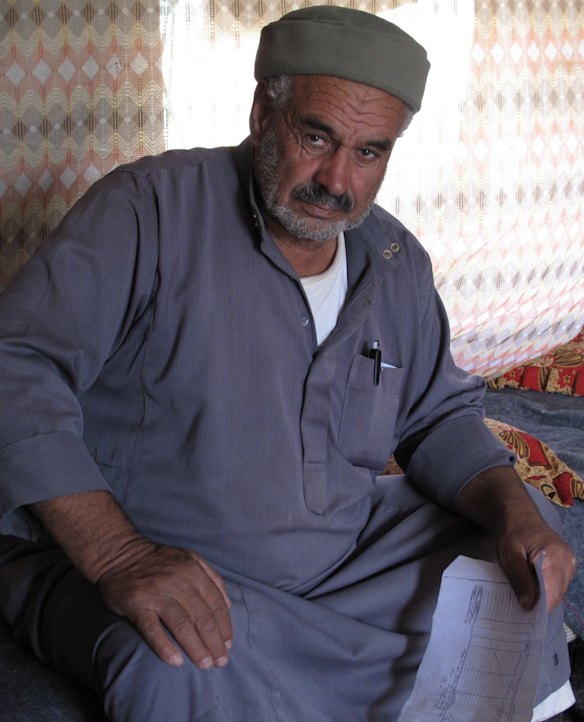 70-year-old Susiya resident Mohamed Nawaja holding what he says are the Ottoman-era title deeds to the family's land.
