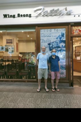 Kelvin (left) and 'Skinny' Kok Wing outside the restaurant.