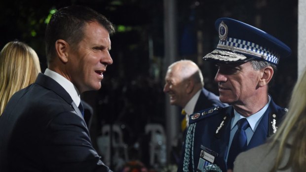 Police Commissioner Andrew Scipione - at the Anzac Day Dawn Service with NSW Premier Mike Baird on Monday - announced the arrest shortly after the service began.