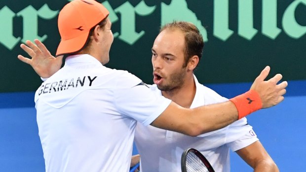 Upset: Jan-Lennard Struff and Tim Puetz of Germany celebrate the vital doubles win.