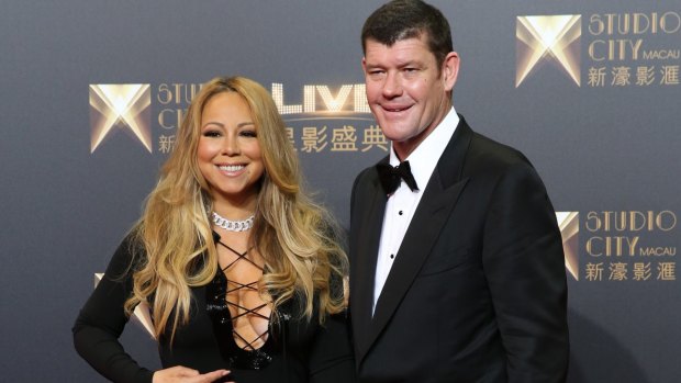 Golden couple: James Packer and Mariah Carey pose on the red carpet at Melco Crown's Studio City opening night in Macau.