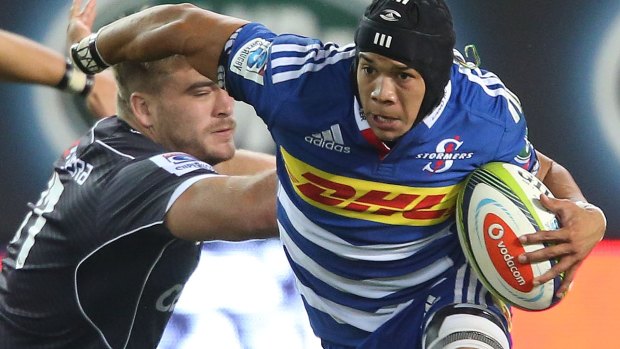 Evasive action: Cheslin Kolbe of the Stormers swerves through the Sharks defence.