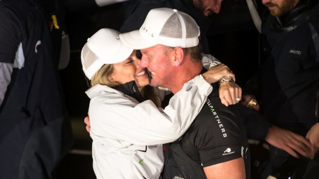 Kelly Landry and Anthony Bell embrace at Constitution Dock after he claimed line honours in the 2016 Sydney to Hobart Yacht Race.