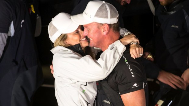 Kelly Landry and Anthony Bell embrace at Constitution Dock after he claimed line honours in the 2016 Sydney to Hobart Yacht Race.