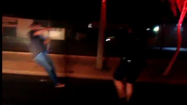 Stills from a video showing a confrontation between a man and police in Mt Isa. The man was tasered during the incident, but was later found not guilty by a Magistrate.