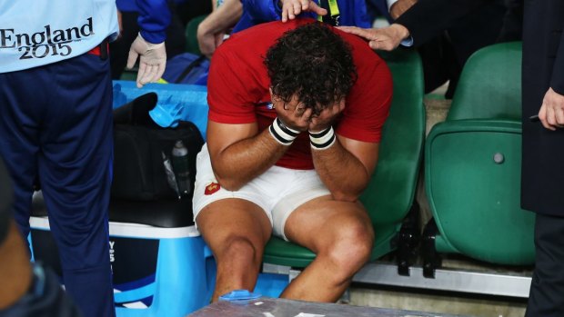 Dream over: Yoann Huget of France is distraught following his injury.