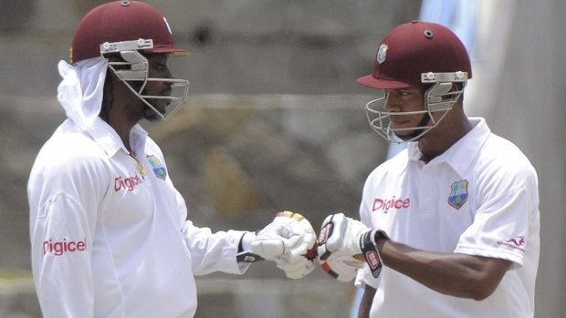 West Indies' openers Chris Gayle (left) and Kieran Powell celebrate after reaching a 200-run partnership against New Zealand in 2012.