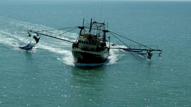 Divers may not be able to reach a prawn trawler that capsized near Fraser Island.