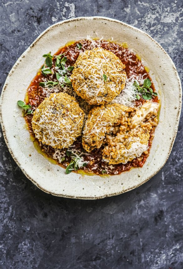 Cheesy bolognese arancini in tomato sauce.