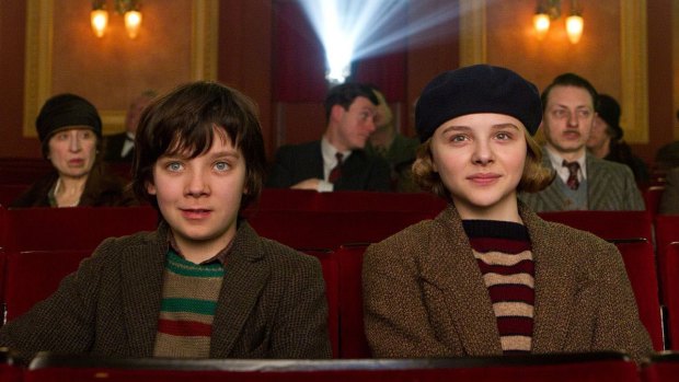 Asa Butterfield and Chloe Grace Moretz play two orphans seeking a toy-seller's secret in <i>Hugo</I>.