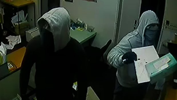 Police are looking for two men in connection with a series of post office break and enters. 