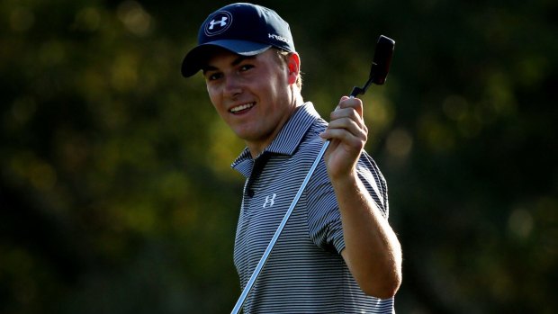 Jordan Spieth reacts after putting for birdie on the 18th green.