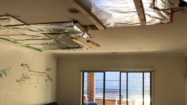 A patched-up ceiling in a new townhouse in South Morang, where water crashed through the ceiling during the December 29 storm.