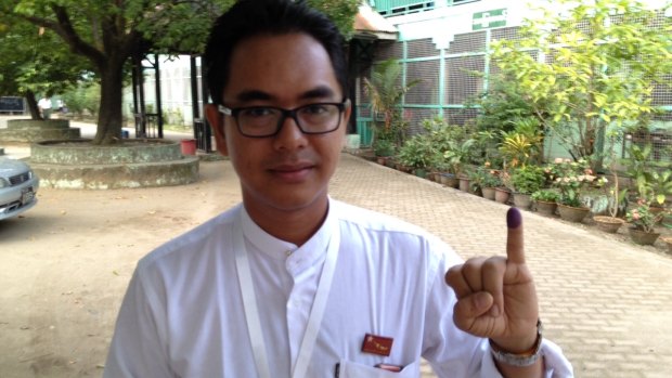 Former political prisoner Nay Phone Latt, who is standing for the opposition National League for Democracy, after voting for the first time. 