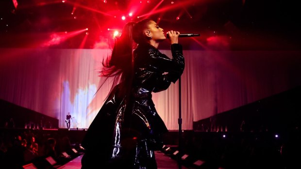 Ariana Grande singing live as part of her Dangerous Woman tour.