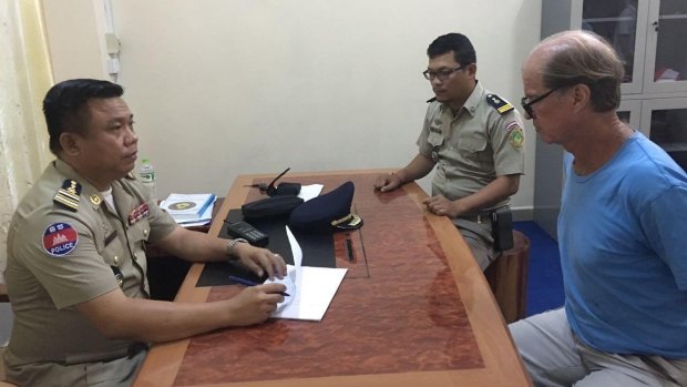 Australian filmmaker James Ricketson in police custody in Phnom Penh.