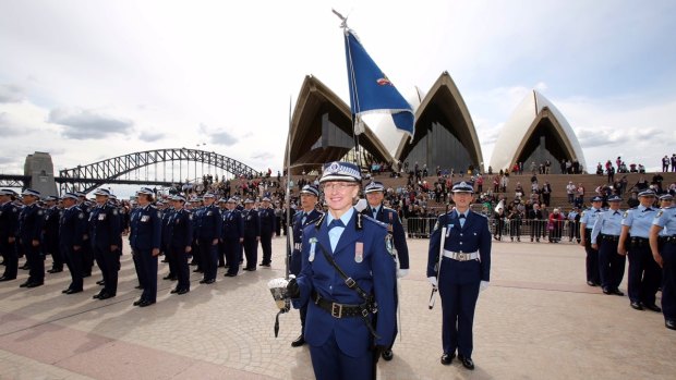 Chief Superintendent Donna Adney leads a parade at the Sydney Opera House as part of the 100 years of women in policing celebrations. 