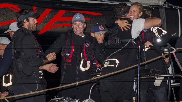 Success is sweet: The crew of Comanche celebrate in Hobart.