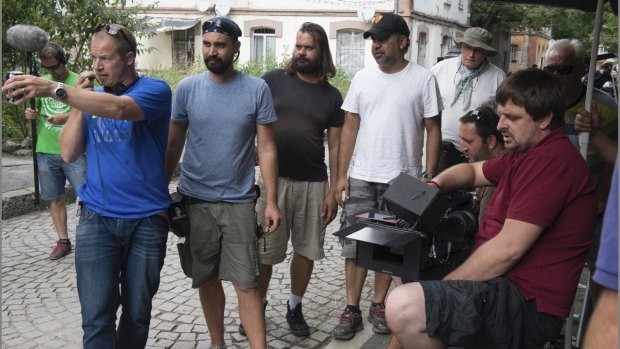 Director Wayne Blair (in black cap) on set with the crew of <i>Septembers of Shiraz</i>.