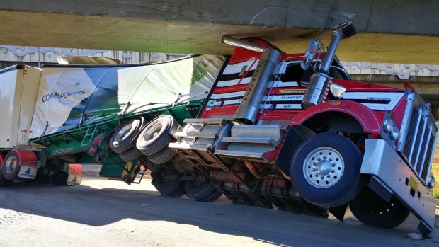 The truck was 53 centimetres too tall to fit under the bridge.
