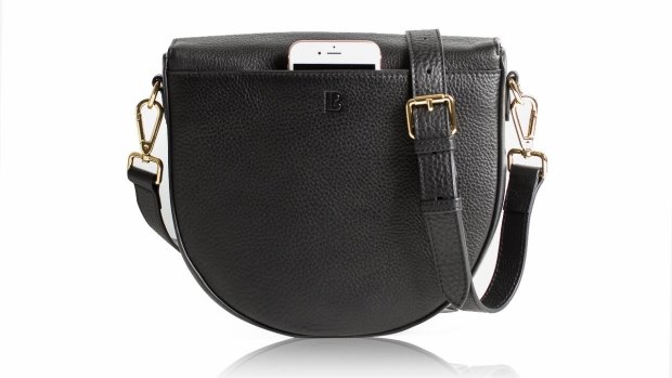 Lorna & Bell's sleek bag makes phone charging a fashion statement.