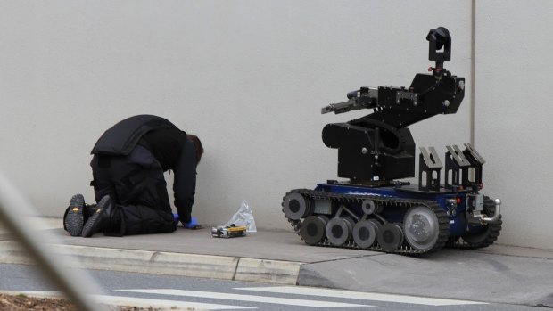 The bomb squad investigates a suspicious device found at Ipswich Homebase on Wednesday morning. 