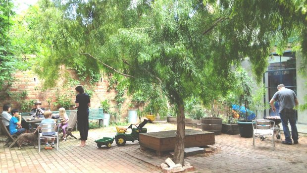 The courtyard shared by four families in a converted Fitzroy factory, designed by Kerstin Thompson Architects. 