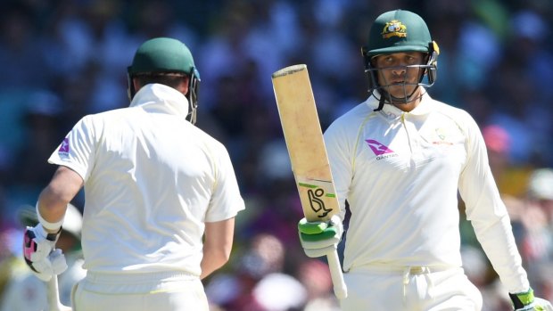 Plenty to play for: Usman Khawaja registers his 50, and will start play on the third day just nine runs shy of a century.