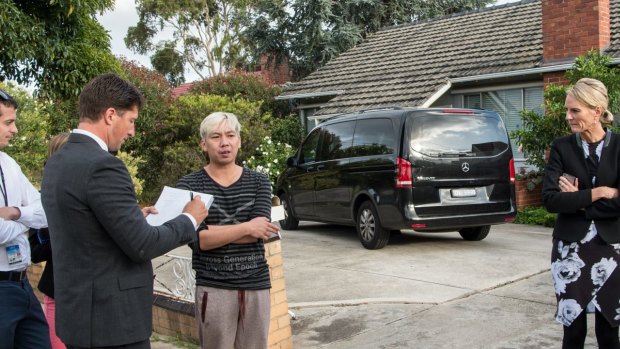 The couple's son Vinh Le speaks to media outside the family's home.