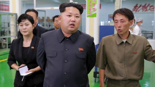 North Korean leader Kim Jong-un, centre, has won an award due to his "persistence in fighting neocolonialism".