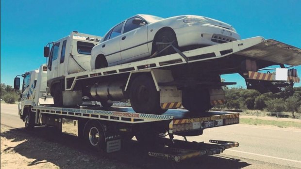 Police took this picture of a tow truck on a tow truck.
