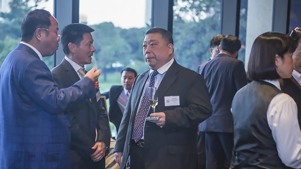 Huang Xiangmo (far left) and NSW state MP  Ernest Wong at the 2014 unveiling of an Australian Guangdong Chamber of Commerce plaque at NSW Parliament.