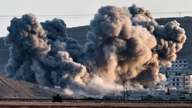 Smoke rises after an air strike in Kobane.